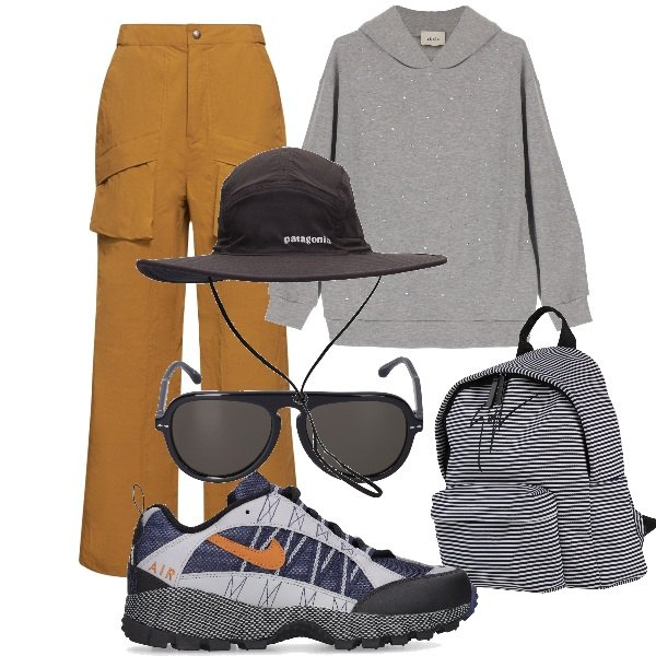 Outfit donna - Comminando in montagna. Stile Sporty chic per Sport. Abbinamento con zaini, felpe con cappuccio, sneakers, pantaloni cargo, occhiali da sole, cappelli.