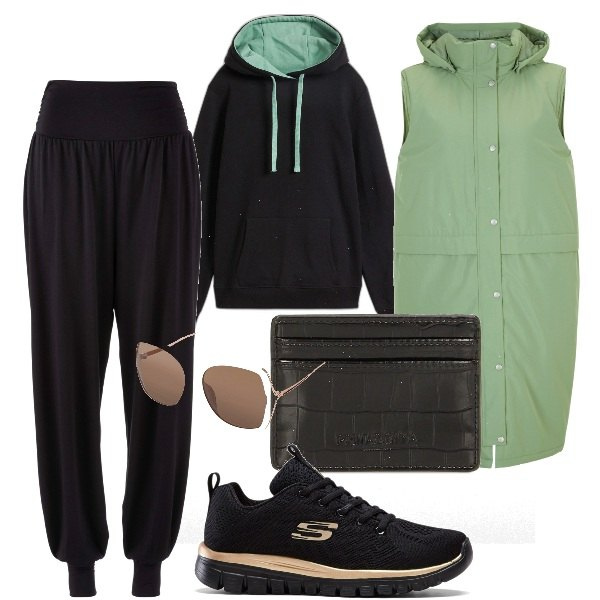 Outfit donna - Piumino lungo smanicato Bonprix. Stile Casual chic per Tutti i giorni. Abbinamento con pantaloni sportivi, sneakers, piumini, felpe con cappuccio, occhiali da sole, portafogli.