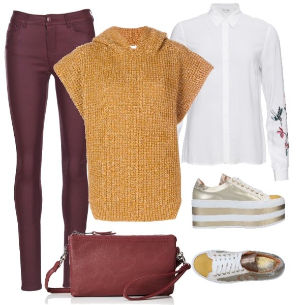 Outfit donna - Ocra. Stile Trendy per Tutti i giorni. Abbinamento con sneakers tennis, camicetta con ricamo a maniche lunghe bianco, jeans slim fit rosso, poncio con cappuccio giallo, shopping bag rosso.