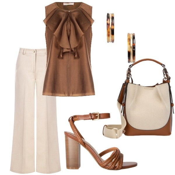 Outfit donna - Il top in raso e il pantalone palazzo. Stile Bon Ton per Serata fuori. Abbinamento con bluse, pantaloni, orecchini, borse a mano, sandali col tacco.