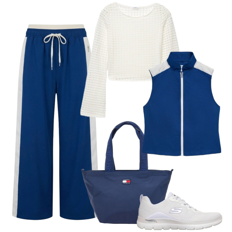 Outfit donna - Blu layering in montagna. Stile Casual per Tutti i giorni. Abbinamento con pantaloni, gilet, maglieria, scarpe sportive, borse tote.
