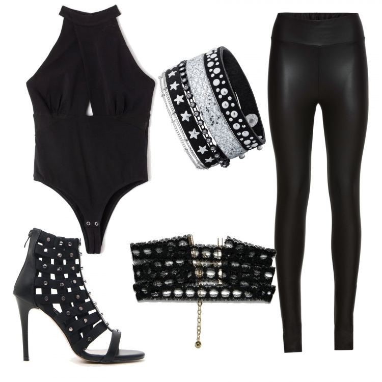 Outfit donna - Asia Argento dark lady. Stile Sexy per Serata fuori. Abbinamento con treggings, bracciale con strass glitter nero, body in tulle nero, collana con pizzo e fasce con catenina oro, tronchetti.