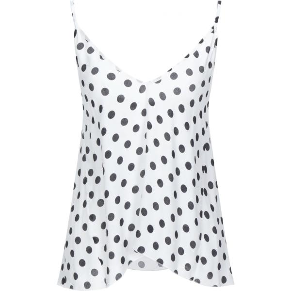 top Carla G. blanco de lunares